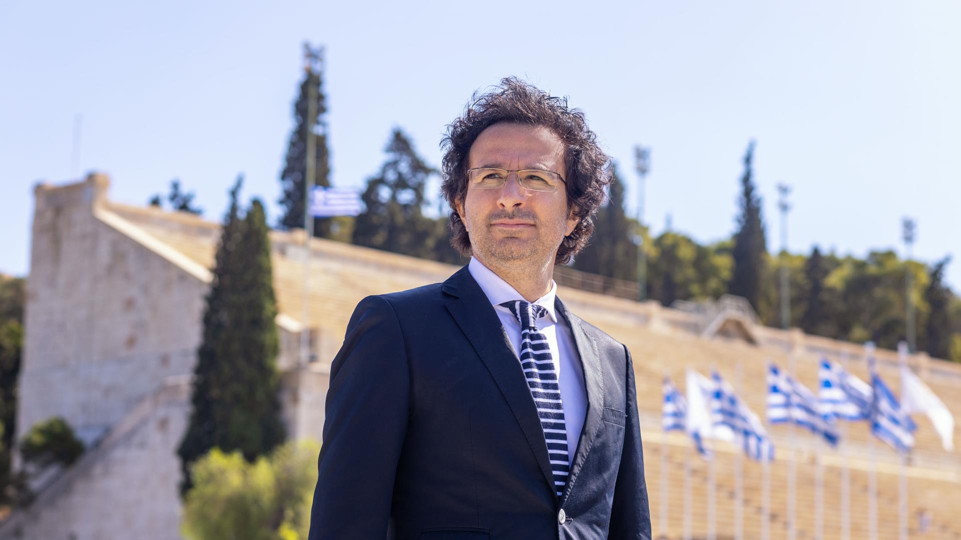 &Mu;ά&rho;&iota;&omicron;&sigmaf; &Iota;. &Eta;&lambda;ί&alpha;: &Eta; &delta;&eta;&mu;&iota;&omicron;&upsilon;&rho;&gamma;ί&alpha; &mu;&omicron;&upsilon;&sigma;&iota;&kappa;ή&sigmaf; &gamma;&iota;&alpha; &tau;&eta;&nu; &Omicron;&lambda;&upsilon;&mu;&pi;&iota;&alpha;&kappa;ή &Phi;&lambda;ό&gamma;&alpha; &alpha;&pi;&omicron;&tau;&epsilon;&lambda;&epsilon;ί ύ&psi;&iota;&sigma;&tau;&eta; &kappa;&alpha;&lambda;&lambda;&iota;&tau;&epsilon;&chi;&nu;&iota;&kappa;ή &epsilon;&upsilon;&theta;ύ&nu;&eta;